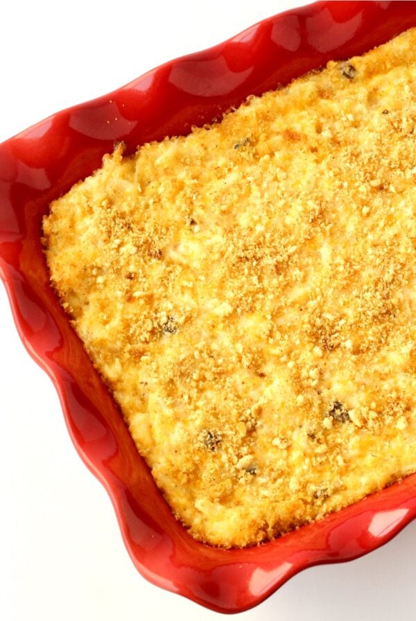 Party Potatoes hash brown casserole with cheese in casserole dish.