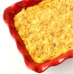 Party Potatoes hash brown casserole with cheese in casserole dish.