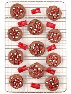 Chocolate peppermint cookies on cookie rack, surrounded by Andes peppermint crunch mints.
