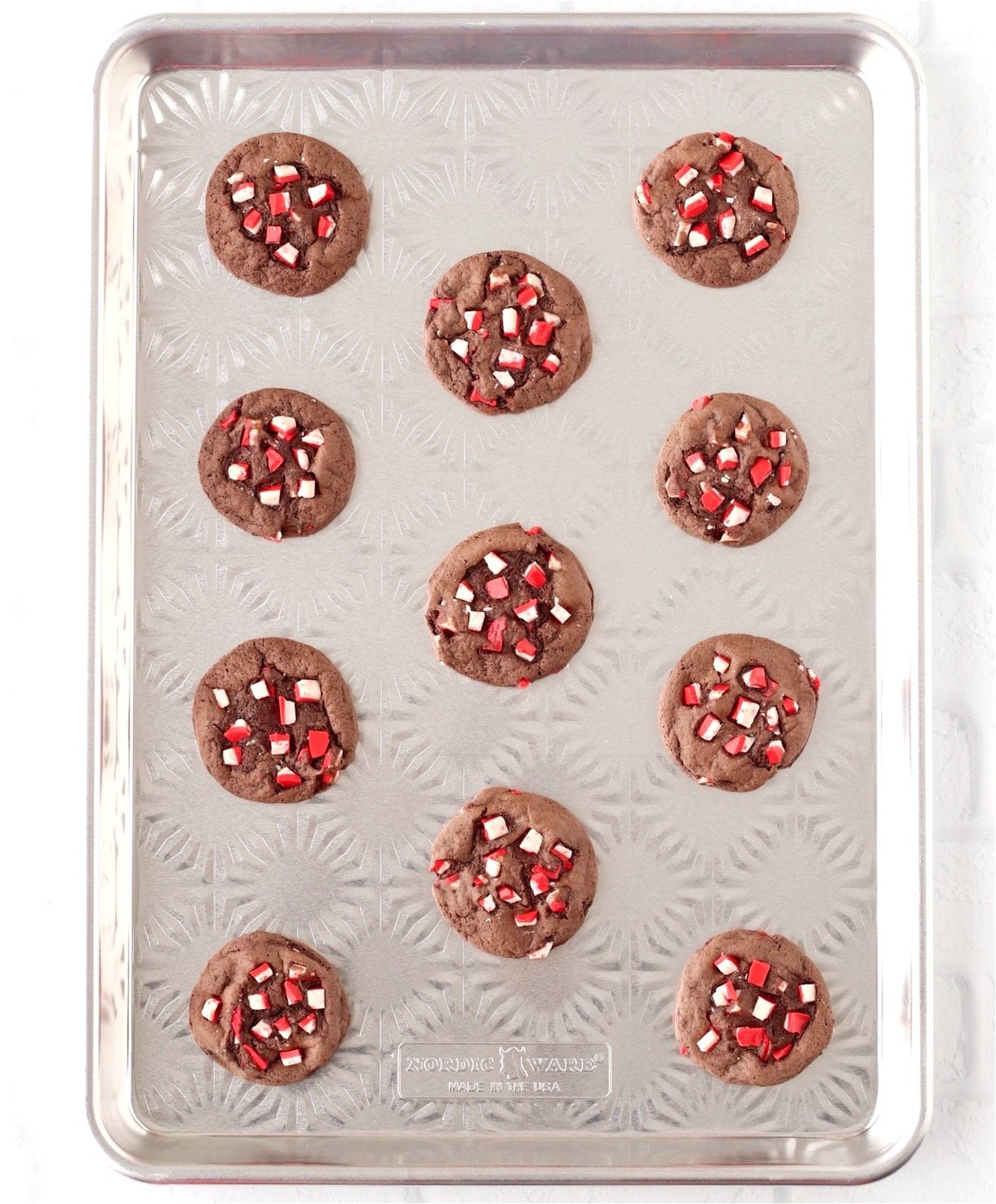 Chocolate peppermint cookies on cookie sheet.