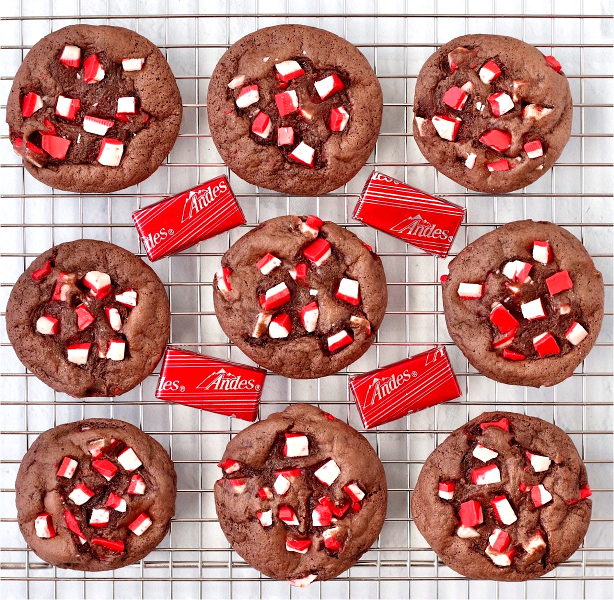 Nine peppermint cookies cooling on cookie rack.