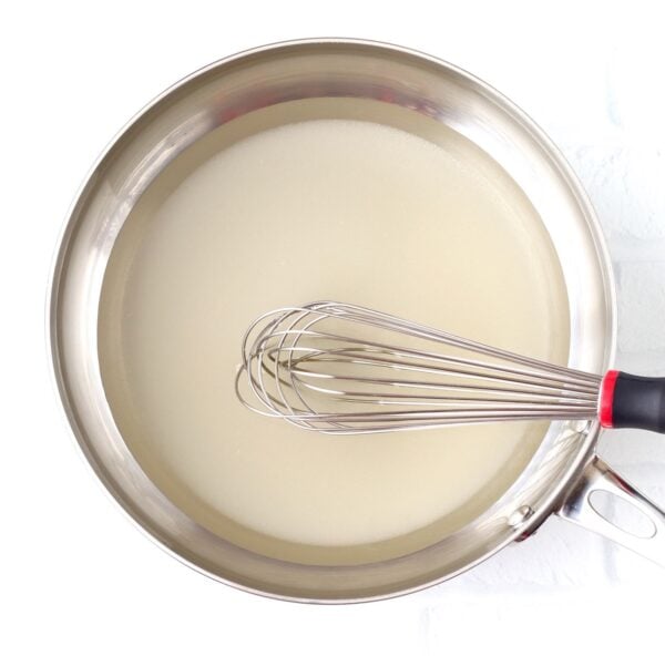 Whisk with pineapple juice and cornstarch in bowl, making sweet and sour sauce.
