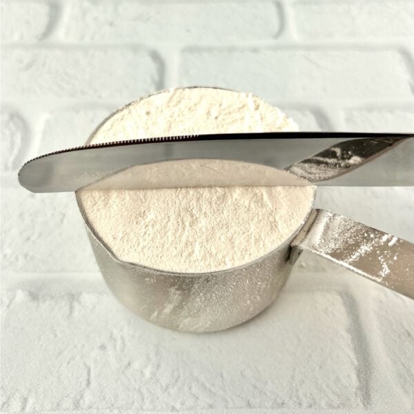 Flour in measuring cup spooned in and leveled off with back of knife.