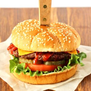 BBQ Burger with cheese, ketchup, pickles, tomato and lettuce.