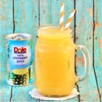 Brunch punch in mason jar with Dole pineapple juice can in background.