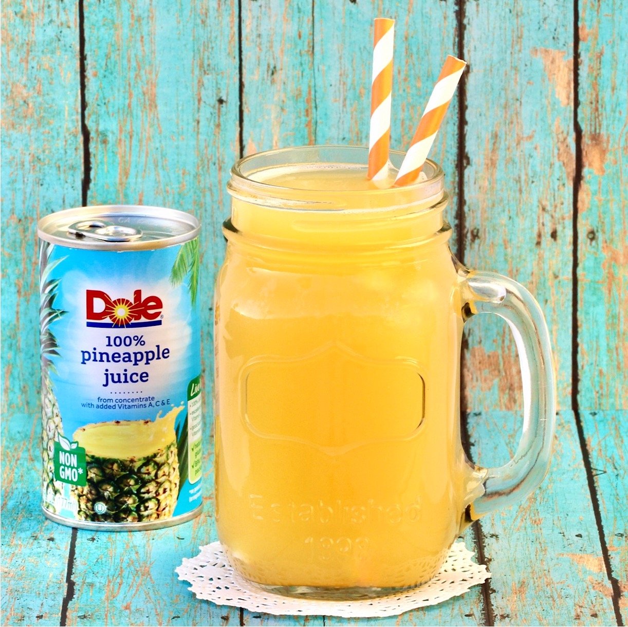 Brunch punch in mason jar with Dole pineapple juice can in background.