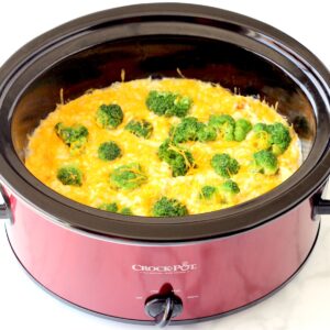 Chicken broccoli rice casserole in crock pot with cheese.