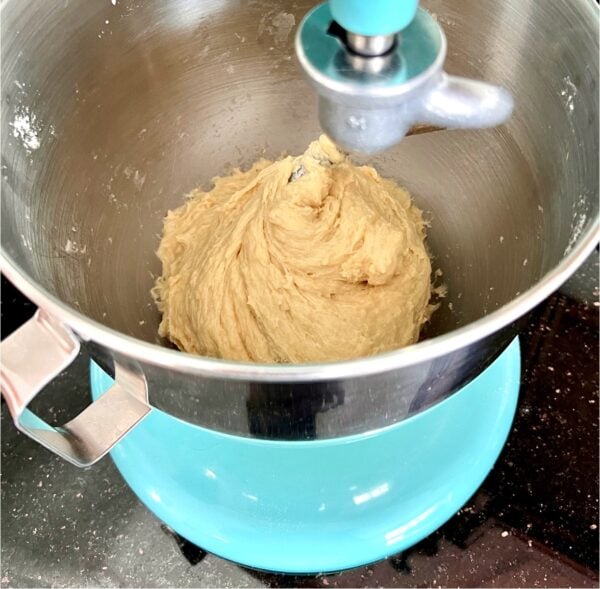 Dough forming with dough hook in Kitchenaid stand mixer.