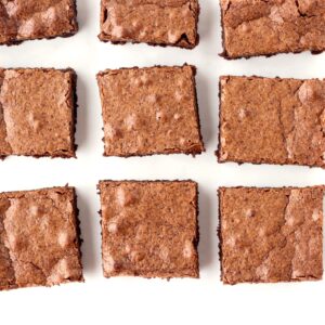 Nine chocolate homemade brownies cut into squares.