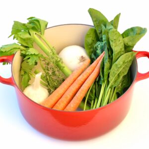 Fresh ingredients for Olive Garden chicken gnocchi soup in dutch oven.