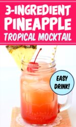 Pineapple mocktail in mason jar mug with straw, pineapple wedge and cherry on top.
