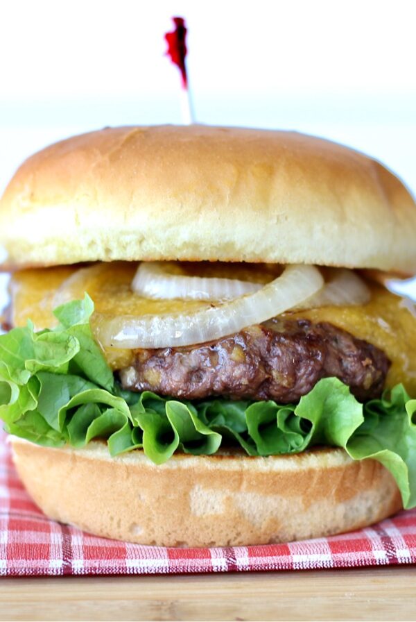 Ranch burger with lettuce, melted cheese and grilled onions.