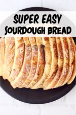 Sliced sourdough bread loaf on plate.