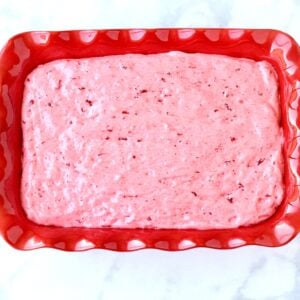 Strawberry angel food cake batter in 9x13 baking dish.