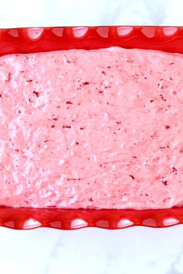 Strawberry angel food cake batter in 9x13 baking dish.