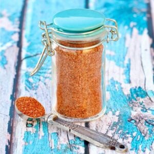 Homemade burger seasoning mix in small jar.