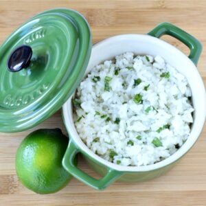 Cilantro lime rice in bowl with lime to the side.