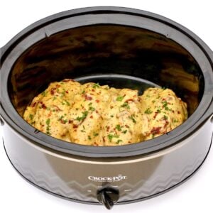 Four pieces of Tuscan Chicken in crock pot.