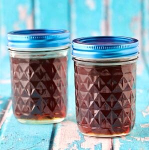 Two mason jars filled with homemade maple syrup.