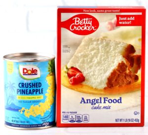 Can of crushed pineapple and box of angel food cake mix - ingredients for pineapple angel food cake.