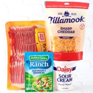 Ingredients to make ranch dip with bacon, cheddar and sour cream.