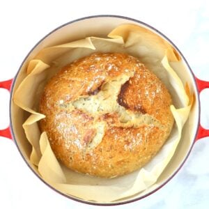 Loaf of rosemary bread baked in dutch oven.