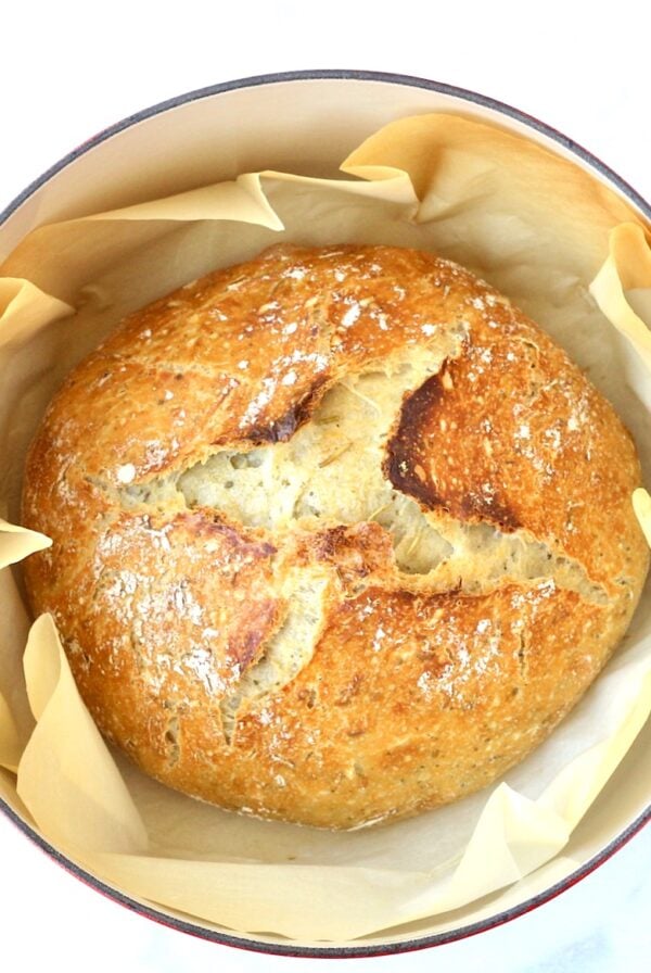 Loaf of rosemary bread baked in dutch oven.