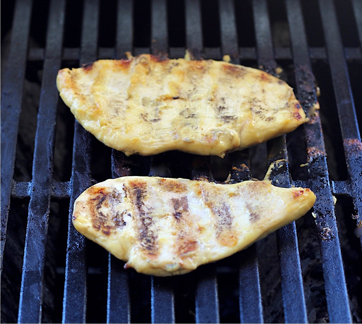 Honey Mustard grilled chicken on grill.