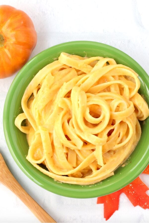 Pumpkin pasta in bowl with fork to the side.