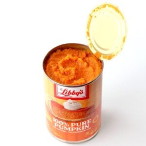 Canned pumpkin with open lid.