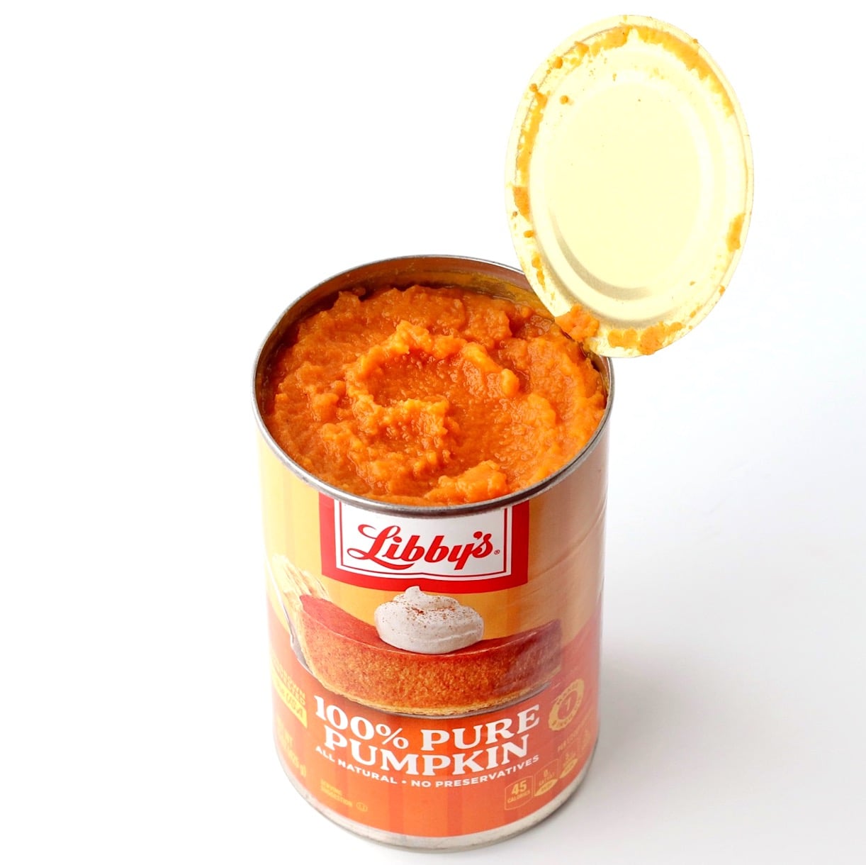 Canned pumpkin with open lid.