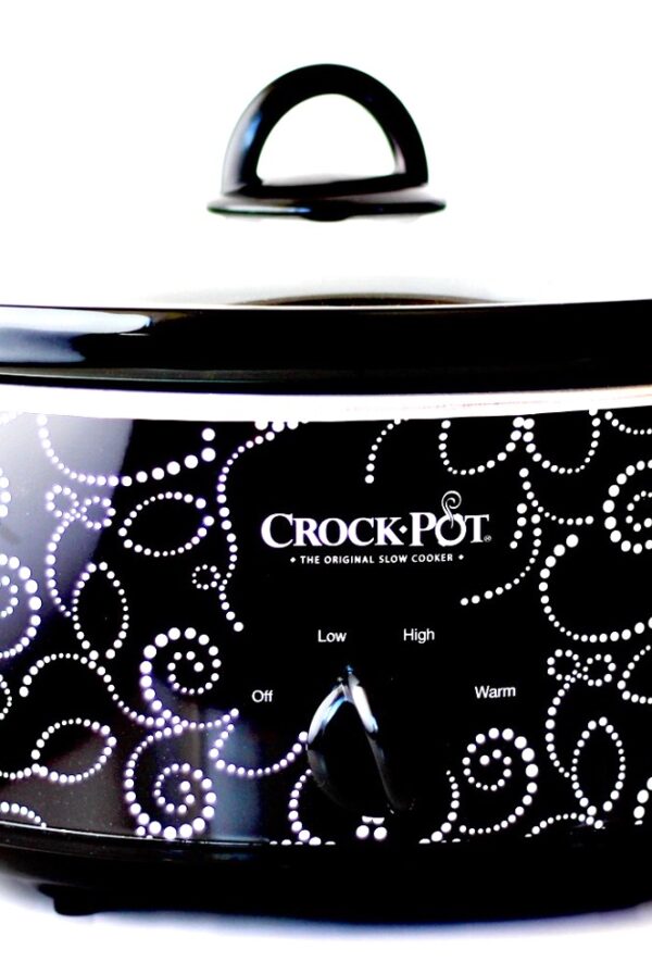 Black and white slow cooker with lid.