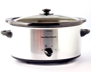 Crock Pot with Baked Potatoes inside.