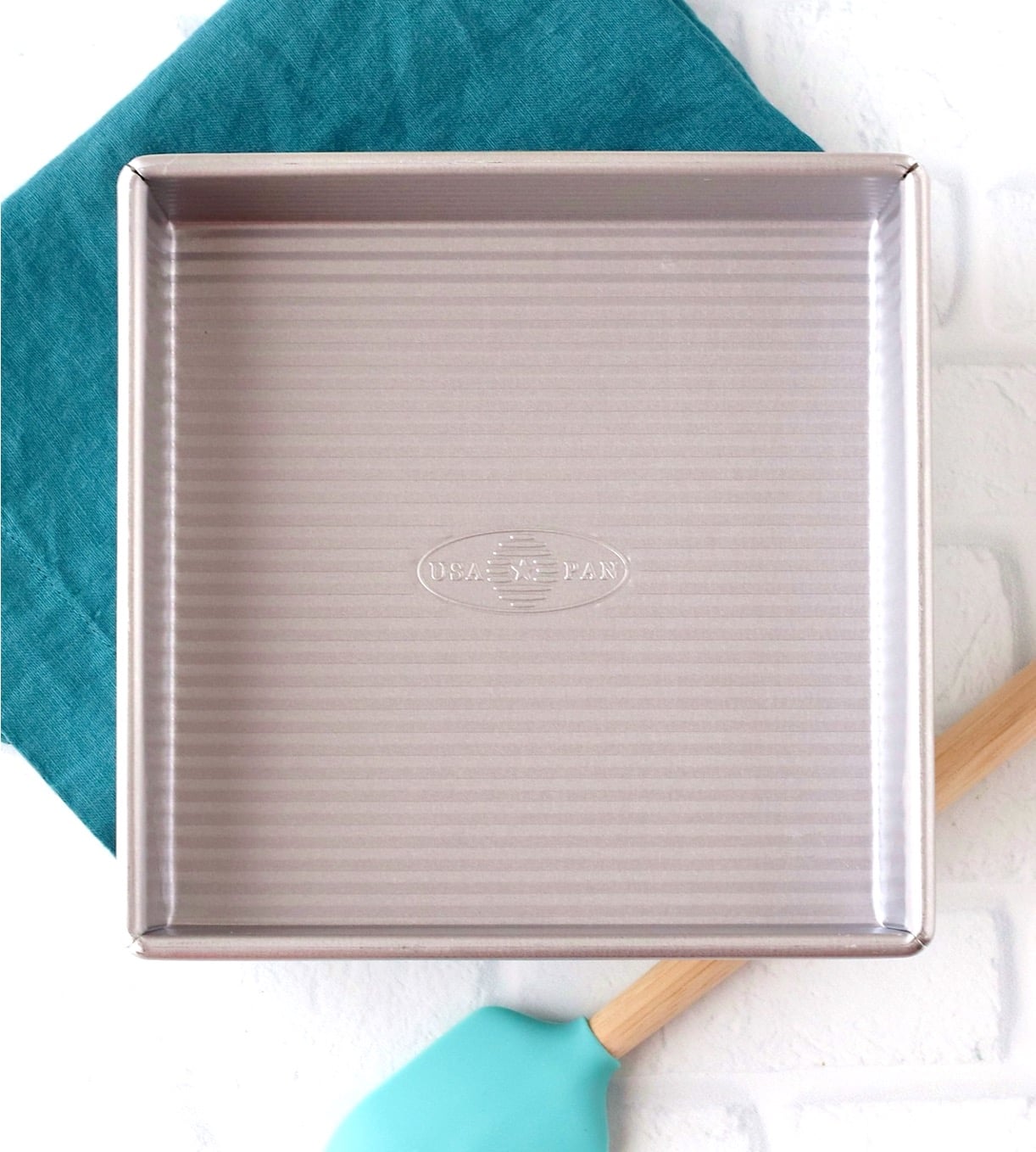 8x8 Pan for Baking Brownies with napkin and spatula to the side.