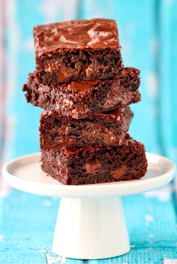 Stack of four chocolate chip brownies.