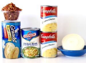 Ingredients for crockpot chicken and dumplings with canned biscuits.