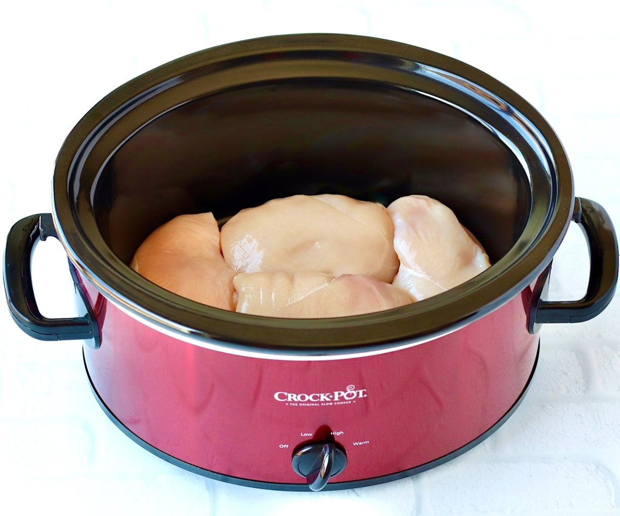 Raw chicken in crock pot.
