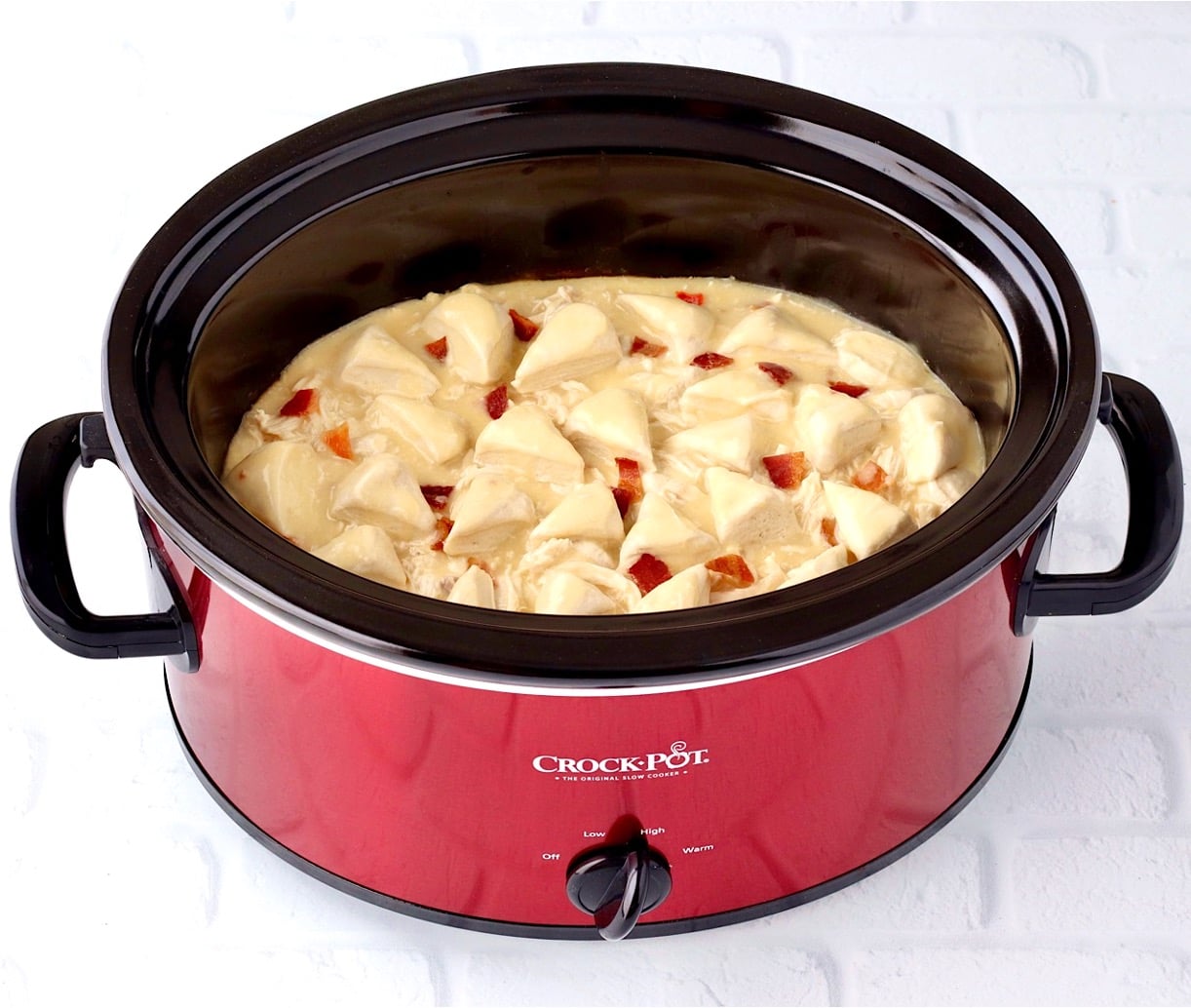 Chicken and dumplings cooking in crockpot.