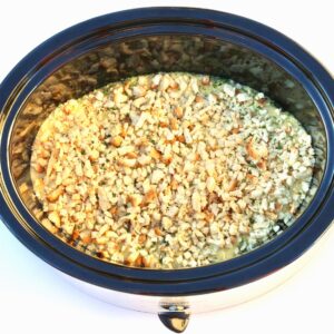 Chicken and stuffing casserole cooking in crockpot.