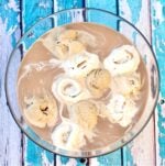 Mocha coffee punch with scoops of coffee ice cream, vanilla ice cream, and chocolate in punch bowl.