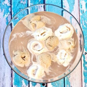 Mocha coffee punch with scoops of coffee ice cream, vanilla ice cream, and chocolate in punch bowl.