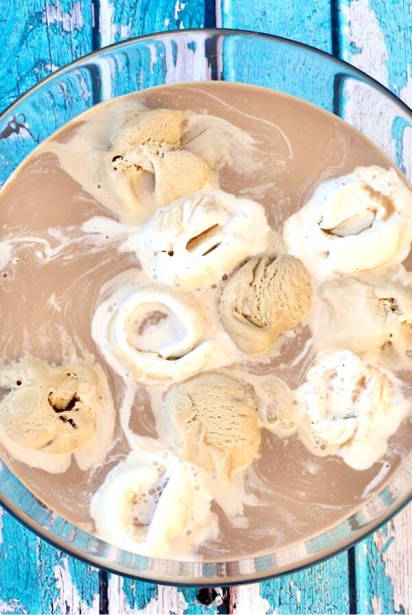 Mocha coffee punch with scoops of coffee ice cream, vanilla ice cream, and chocolate in punch bowl.