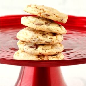 Stack of Toffee Cookies on red cake stand.