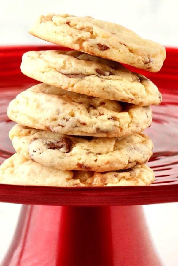 Stack of Toffee Cookies on red cake stand.