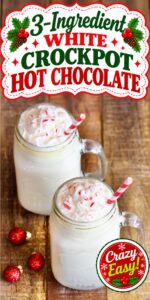 White hot chocolate in mason jar mugs with whip cream and crushed candy canes on top.